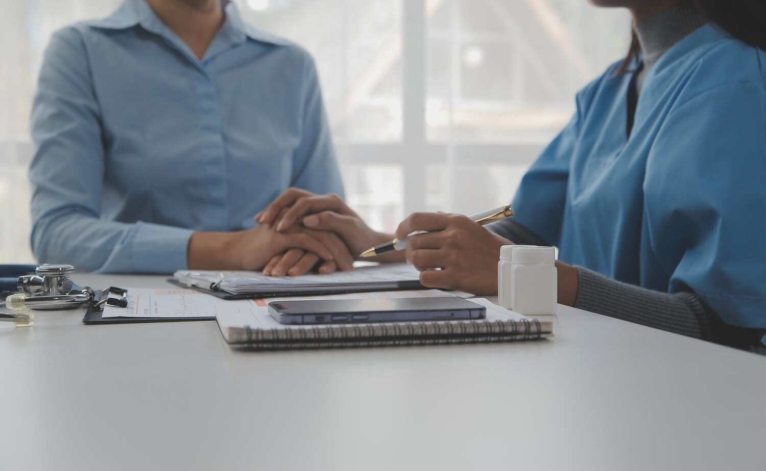Young woman comes clinic heart lungs checkup friendly female doctor sitting desk modern medical office holding stethoscope listening patient s breath heartbeat smiling 265022 58806